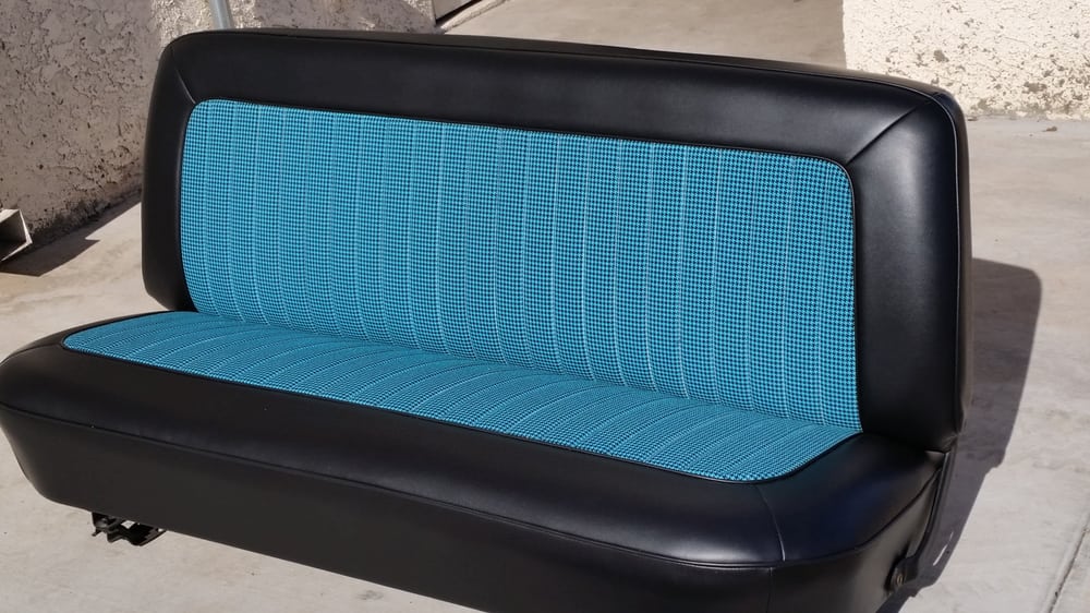 A picture of a leather car seat in blue and black color